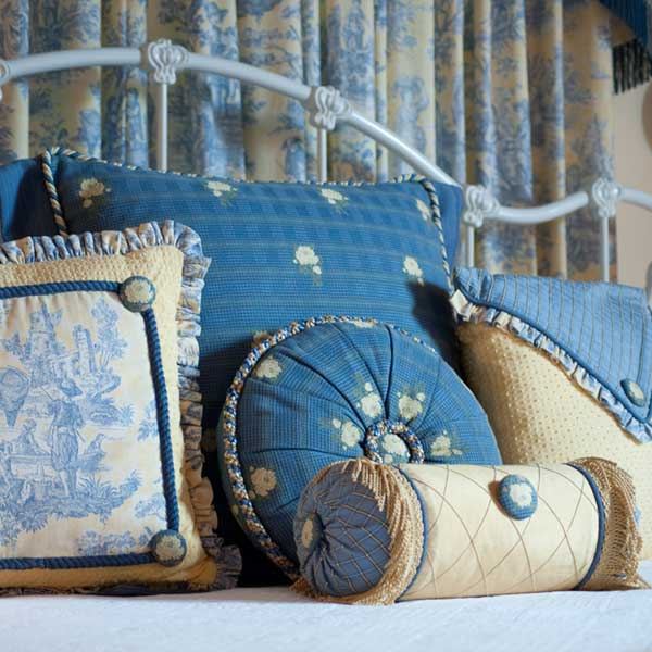 Detail of the Blue Room bed with blue and cream toile pillows